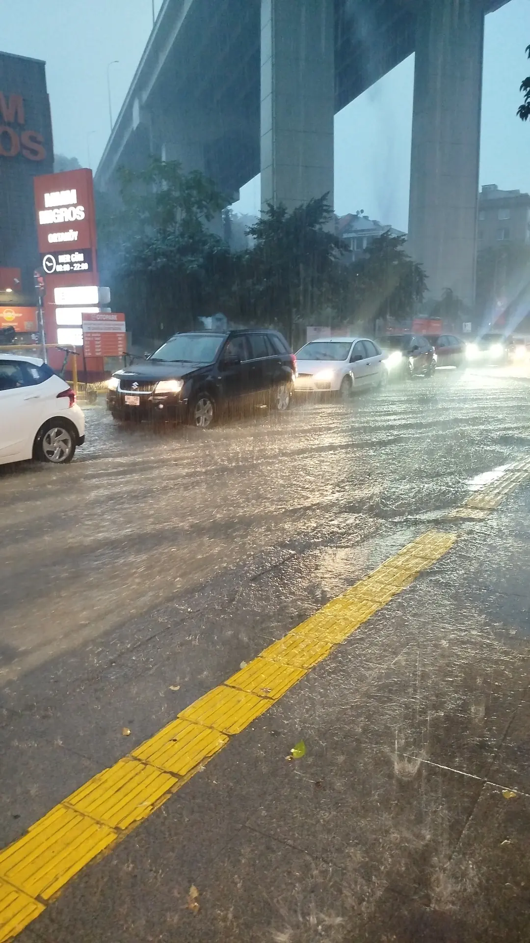 Floodwater runs across a road in Ortaköy, Istanbul, during the downpour on October 14, 2026.