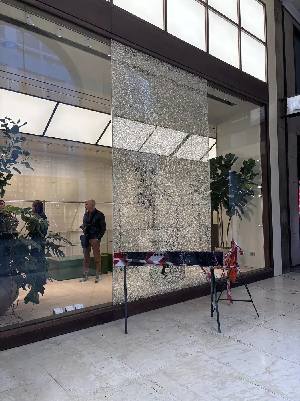 A broken shopfront in Milan, photographed on October 19, 2026, after the weekend riots, according to the photo's Commons description.
